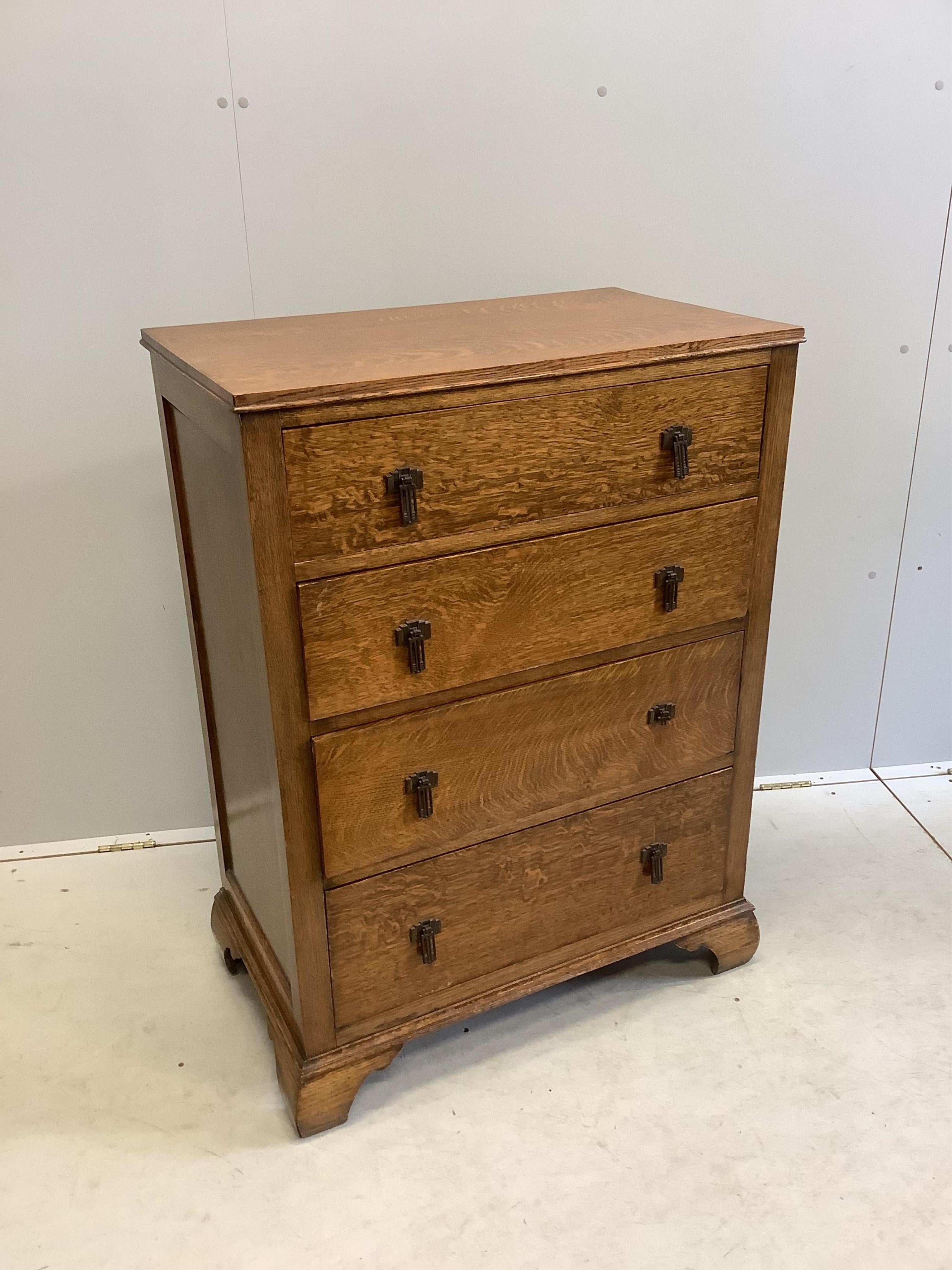 An early 20th century oak chest of four drawers, width 76cm, depth 46cm, height 104cm. Condition - good, one metal handle broken but piece is present